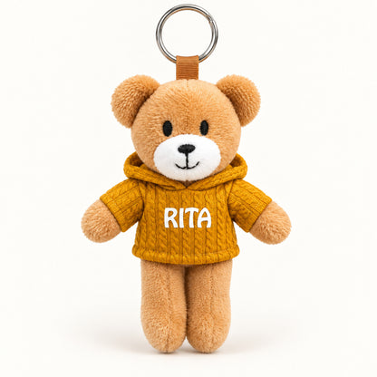 Ursinho Rita — vista completa com argola, fundo branco